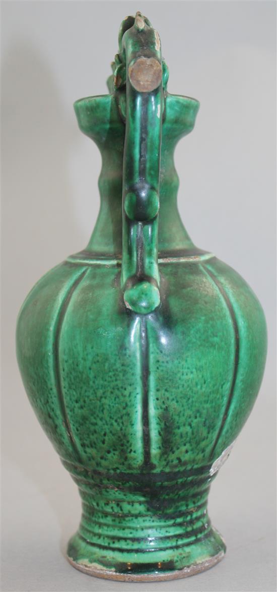 A Chinese green glazed pottery twin handled vase, in Tang style, 20.5cm.